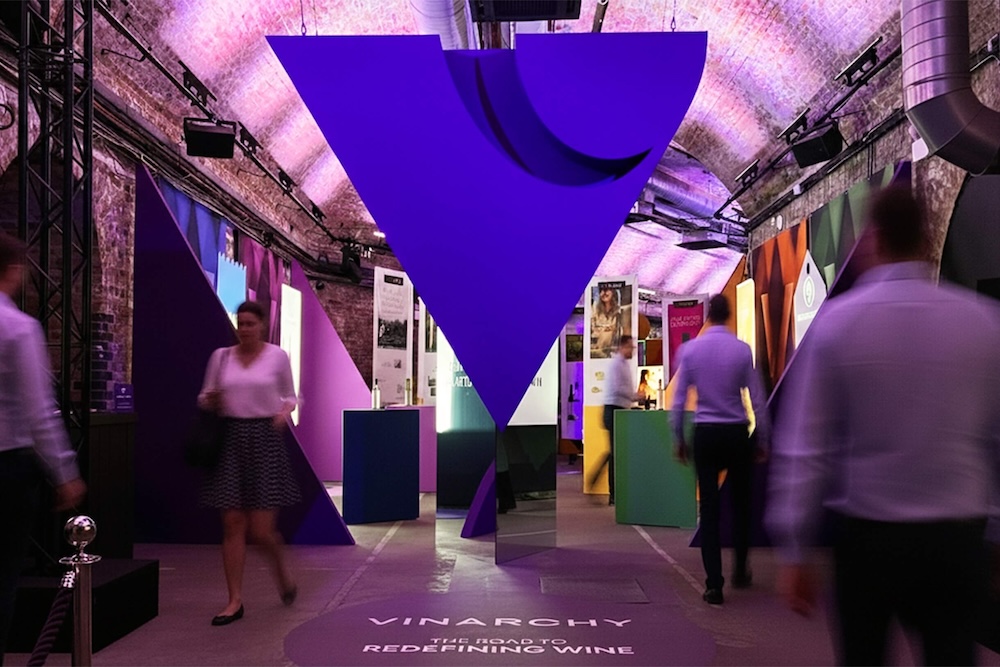House of Vinarchy entrance in the Leake Street Tunnels showing giant logo, shopper displays and people walking between points
