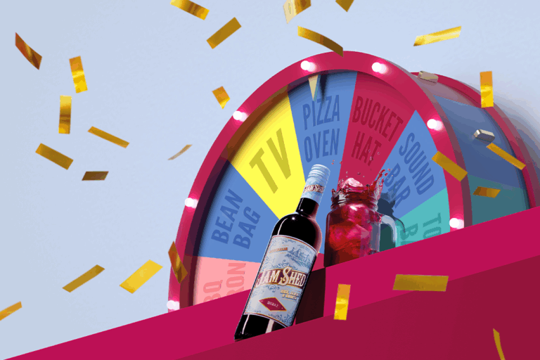 Jam Shed wine bottle and jam jar serve, giant prize wheel showing a 'Pizza Oven' win and gold confetti