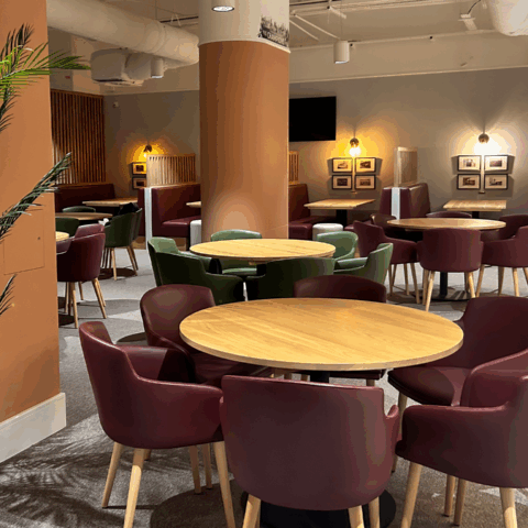 Allianz Stadium Grand Slam hospitality suite dining and booth seating area