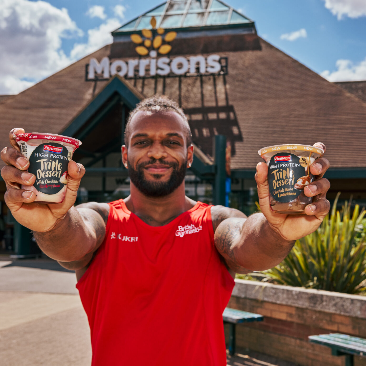 team england athlete with ehrmann puddings outside a morrisons store