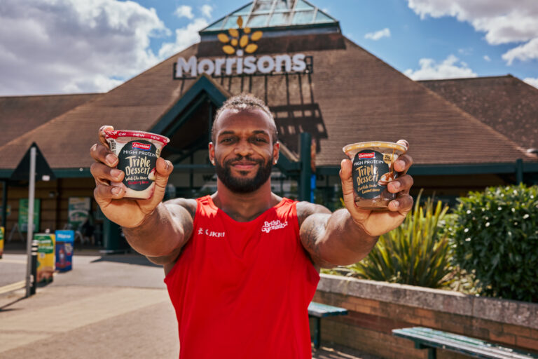 team england athlete with ehrmann puddings outside a morrisons store